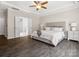 Bright bedroom with neutral tones, tray ceiling, and ensuite bathroom at 11931 The Ramble Dr, Huntersville, NC 28078