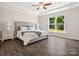 Serene bedroom with tray ceiling, natural light, and a comfortable queen-sized bed at 11931 The Ramble Dr, Huntersville, NC 28078