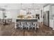 Spacious kitchen with granite island, stylish pendant lighting, stainless steel appliances, and breakfast table at 11931 The Ramble Dr, Huntersville, NC 28078