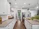 Contemporary kitchen with a large island, stainless steel appliances, and hardwood floors at 11931 The Ramble Dr, Huntersville, NC 28078