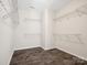 Spacious walk-in closet with wooden floors and multiple levels of wire shelving at 11931 The Ramble Dr, Huntersville, NC 28078