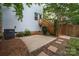 Concrete patio and wooden steps leading to the house provide a private outdoor space at 12224 Huntersville Concord Rd, Huntersville, NC 28078