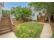 A backyard features green grass, a wooden deck, wooden stairs, and a wooden fence at 12224 Huntersville Concord Rd, Huntersville, NC 28078