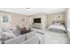 A comfortable bedroom and living area with a sofa, media center, and a queen size bed at 12224 Huntersville Concord Rd, Huntersville, NC 28078
