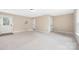 A spacious and unfurnished room features neutral walls, and natural light at 12224 Huntersville Concord Rd, Huntersville, NC 28078