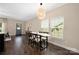 Dining room features hardwood floors, neutral walls and a dining table with seating at 12224 Huntersville Concord Rd, Huntersville, NC 28078
