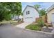 Detached garage with white siding and a concrete driveway in a suburban neighborhood at 12224 Huntersville Concord Rd, Huntersville, NC 28078