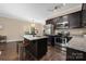 Modern kitchen equipped with granite countertops, stainless steel appliances, and island seating at 12224 Huntersville Concord Rd, Huntersville, NC 28078