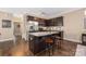 Well-appointed kitchen features granite countertops, stainless steel appliances, and an island at 12224 Huntersville Concord Rd, Huntersville, NC 28078