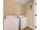 Utility laundry room with washer and dryer hookups, ready for convenience and efficiency at 12224 Huntersville Concord Rd, Huntersville, NC 28078