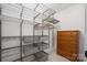 Walk-in closet features custom shelving and a dresser for optimal organization and storage at 12224 Huntersville Concord Rd, Huntersville, NC 28078