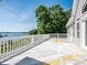 Wide backyard deck, overlooking a lake with a large, picturesque tree line at 125 Mariner Pointe Ln, Mooresville, NC 28117