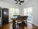 Bright dining area features a wood table and chairs, hardwood floors, and sliding glass doors to the outside at 125 Mariner Pointe Ln, Mooresville, NC 28117