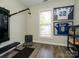 Bright exercise room featuring modern fitness equipment and wood floors at 125 Mariner Pointe Ln, Mooresville, NC 28117