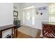 Bright foyer with wood floors, a decorative front door, and stylish accents, creating a welcoming entrance at 125 Mariner Pointe Ln, Mooresville, NC 28117