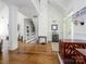 Open-concept layout showcasing the foyer, staircase, and living spaces with hardwood floors and modern finishes at 125 Mariner Pointe Ln, Mooresville, NC 28117