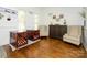 Bright living room with hardwood floors, stylish furnishings, and ample natural light, creating a comfortable atmosphere at 125 Mariner Pointe Ln, Mooresville, NC 28117