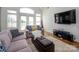 Cozy living room with comfortable seating, hardwood floors, and natural light, perfect for relaxation at 125 Mariner Pointe Ln, Mooresville, NC 28117