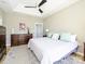 Spacious main bedroom with trey ceiling, fan, and neutral decor at 125 Mariner Pointe Ln, Mooresville, NC 28117
