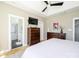 Spacious main bedroom with trey ceiling, fan, and adjacent en suite bathroom at 125 Mariner Pointe Ln, Mooresville, NC 28117