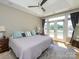 Spacious main bedroom with trey ceiling, fan, french doors to a private balcony, and neutral decor at 125 Mariner Pointe Ln, Mooresville, NC 28117