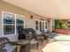 Covered outdoor patio featuring ample seating, grill, and hot tub at 125 Mariner Pointe Ln, Mooresville, NC 28117