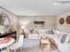 Cozy bonus room with a plush sectional sofa, decorative art, and comfortable seating, perfect for relaxation at 134 Wheeler Trl, Statesville, NC 28625