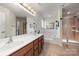 Bathroom featuring double vanity, soaking tub, and walk-in shower at 1403 Rosemont Dr, Fort Mill, SC 29707