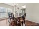 Dining room featuring a dark wood table, seating for six, and lots of natural light at 1403 Rosemont Dr, Fort Mill, SC 29707