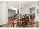 Elegant dining room featuring hardwood floors, chandelier, and seating for six at 1403 Rosemont Dr, Fort Mill, SC 29707