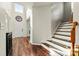 Bright foyer with hardwood floors, staircase, and high ceilings, creating an inviting entrance at 1403 Rosemont Dr, Fort Mill, SC 29707