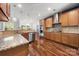 Modern kitchen featuring granite countertops, stainless steel appliances, and an elegant vent hood at 1403 Rosemont Dr, Fort Mill, SC 29707