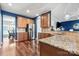 Well-appointed kitchen with stainless steel appliances, granite countertops, and adjacent dining area at 1403 Rosemont Dr, Fort Mill, SC 29707