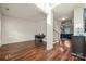 Open-concept living area with hardwood floors, access to the dining room, and staircase view at 1403 Rosemont Dr, Fort Mill, SC 29707