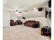 Large living room featuring leather couches, a fan, and a television at 1403 Rosemont Dr, Fort Mill, SC 29707
