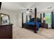 Main bedroom with a four-poster bed, carpeted floors, and lots of natural light at 1403 Rosemont Dr, Fort Mill, SC 29707