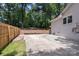 Wide driveway with newly constructed wood fence and partial view of home at 1427 Worcaster Pl, Charlotte, NC 28211