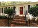 Inviting front entrance with a brick staircase and a vibrant red door at 1427 Worcaster Pl, Charlotte, NC 28211