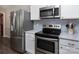 Well-equipped kitchen with stainless steel appliances and updated cabinetry at 1427 Worcaster Pl, Charlotte, NC 28211