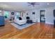 Bright and airy living room with hardwood floors, neutral decor and lots of sunlight at 1427 Worcaster Pl, Charlotte, NC 28211