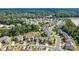 Overhead view of a well-planned neighborhood, highlighting the home's location near lush greenery and community amenities at 15108 Montage Ln, Charlotte, NC 28278