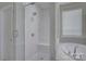 Bathroom featuring a glass-enclosed shower, a tub, and natural lighting at 15108 Montage Ln, Charlotte, NC 28278