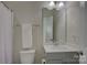 Well-lit bathroom with a gray vanity, a modern sink, and convenient towel storage at 15108 Montage Ln, Charlotte, NC 28278