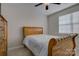 Bright bedroom boasts natural lighting, carpeted floors, neutral walls and wood furnishings at 15108 Montage Ln, Charlotte, NC 28278