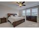 Primary bedroom suite featuring a large bed with side tables and natural lighting at 15108 Montage Ln, Charlotte, NC 28278