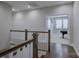 Hallway with hardwood floors leads to a game room with a pool table at 15108 Montage Ln, Charlotte, NC 28278