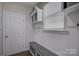 Charming mudroom with bench seating, storage cubbies, and beadboard walls at 15108 Montage Ln, Charlotte, NC 28278