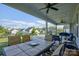 An exterior view of a screened porch with outdoor dining and seating at 15108 Montage Ln, Charlotte, NC 28278