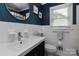 Well-lit bathroom featuring a sleek vanity and modern fixtures at 1514 Wensley Dr, Charlotte, NC 28210