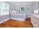 Sun-filled bedroom with hardwood floors and neutral decor at 1514 Wensley Dr, Charlotte, NC 28210
